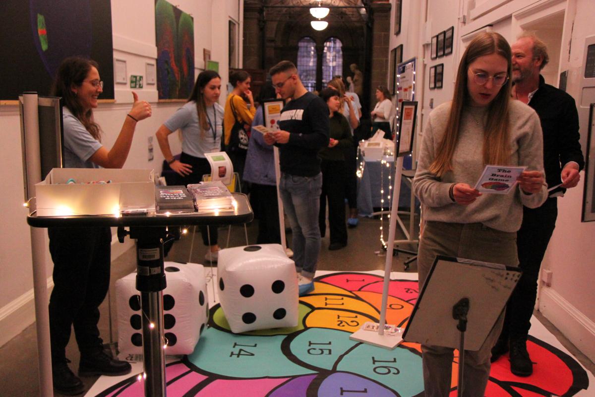 Photo of students interacting with quiz players